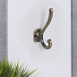 Крючок меб. двухрожковый мет. AКKORD матовая античная латунь AKS 68416